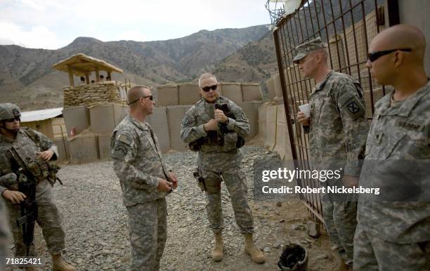 Army Brigadier General James Terry speaks with the commanding officers from the Army's 10th Mountain Division's 3-71 Cavalry at a Forward Operation...