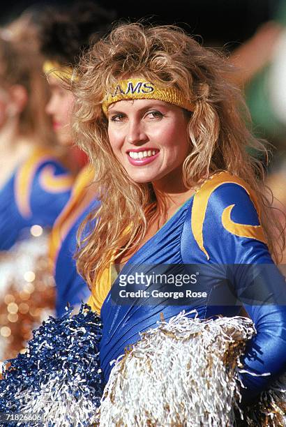 Rams cheerleader smiles for the camera during a game between the Atlanta Falcons and the Los Angeles Rams at Anaheim Stadium on December 13, 1987 in...
