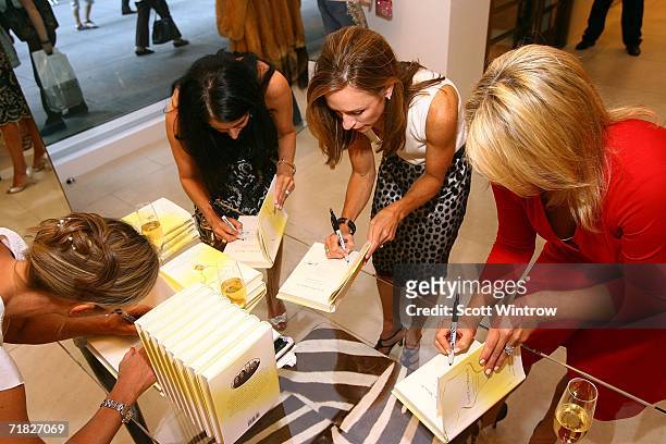 Authors Ann Haynes, Julia Collins, Claudia Gerbasi and Patricia Carrington sign copies of the book at launch of "Love You, Mean It" presented by...