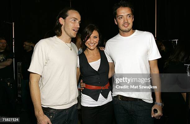 Designer David Neville, actress Cameron Diaz and designer Marcus Wainwright stand backstage at the Rag & Bone Spring 2007 fashion show during Olympus...