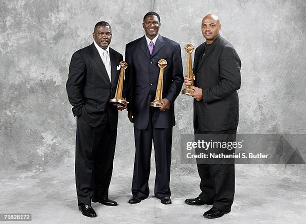 Hall of Fame inductees Joe Dumars, Dominique Wilkins and Charles Barkley pose with their trophies during the 2006 Basketball Hall of Fame induction...