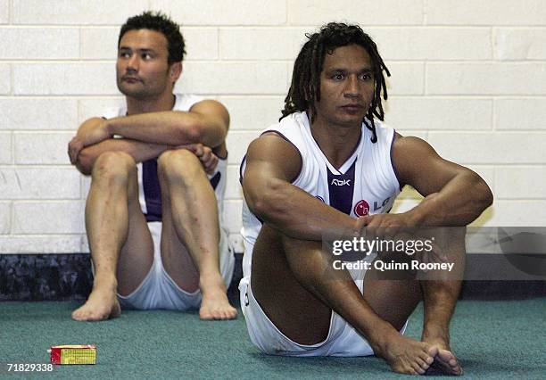 Peter Bell and Troy Cook of the Dockers sit looking dejected in the rooms after losing the AFL Second Qualifying Final match between the Adelaide...