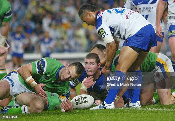 Andrew Ryan of the Bulldogs looks to referee Shayne Hayne after he scored during the NRL Third Qualifying Final between the Bulldogs and the Canberra...