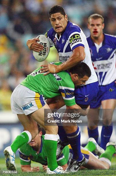 Willie Mason of the Bulldogs is tackled during the NRL Third Qualifying Final between the Bulldogs and the Canberra Raiders at Telstra Stadium...