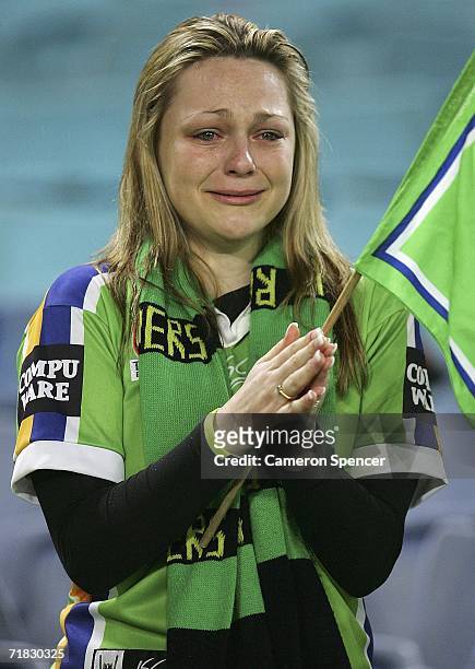 Raiders fan weeps after her team was defeated in the NRL Third Qualifying Final between the Bulldogs and the Canberra Raiders at Telstra Stadium...