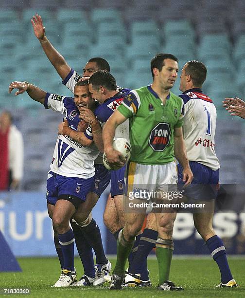 Hazem El Masri of the Bulldogs celebrates scoring a try with team mates during the NRL Third Qualifying Final between the Bulldogs and the Canberra...