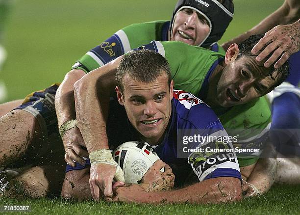 Daniel Holdsworth of the Bulldogs slides over the tryline unsucessfully during the NRL Third Qualifying Final between the Bulldogs and the Canberra...