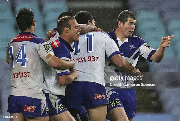Bulldogs players celebrate a try during the NRL Third Qualifying Final between the Bulldogs and the Canberra Raiders at Telstra Stadium September 9,...