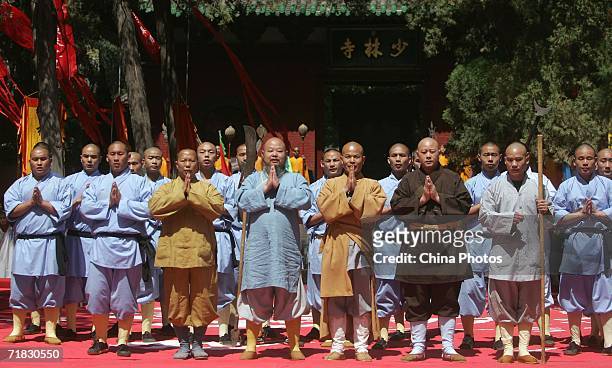 Monks pay respect to visitors during the Chinese Kungfu Star TV Contest at the Shaolin temple on September 9, 2006 in Dengfeng of Henan Province,...