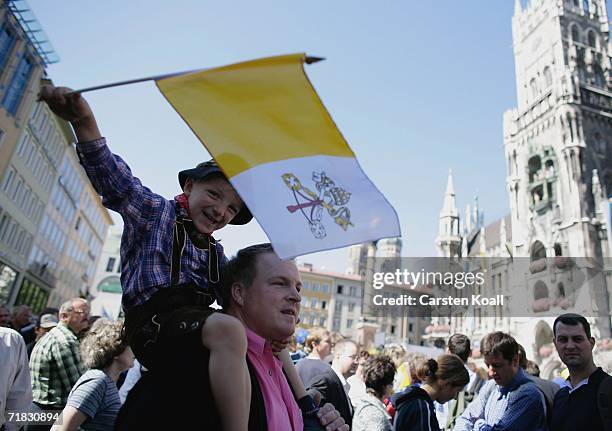 Young bavarian boy shows a flag with the Pope sign on September 9, 2006 durung the pope visit in Munich, Germany. The Bavarian capital Munich is one...