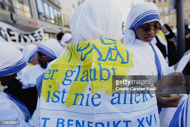 Pilgrim wear a flag with print "Wer glaubt ist nie allein" means "Who beleves is never allone" on September 9, 2006 durung the pope visit in Munich,...