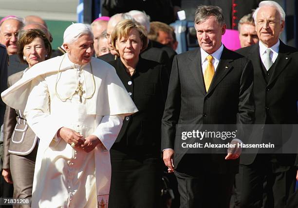 Pope Benedict XVI is welcomed after his arrival by German chancellor Angela Merkel , German Minister president Horst Koehler and Bavarians Prime...