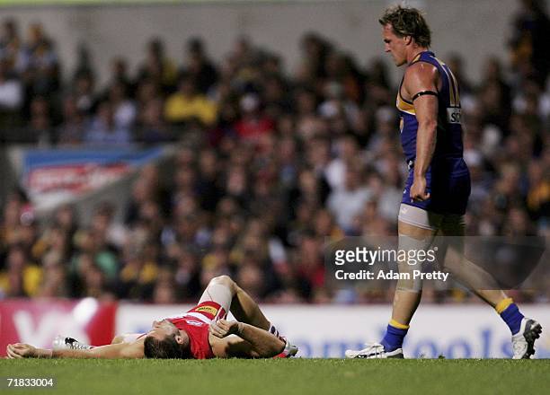 Nick Malceski of the Swans is flattened by Daniel Chick of the Eagles during the AFL First Qualifying Final between the West Coast Eagles and the...