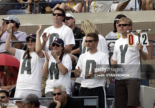 Fans supporting number 9 seed Andy Roddick of the US spell out his name on shirts as he plays Mikhail Youzhny of Russia 09 September 2006 in the...