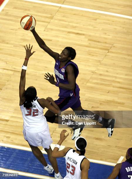 Hamchetou Maiga-Ba of the Sacramento Monarchs shoots a layup against Swin Cash of the Detroit Shock during Game Five of the WNBA Finals September 9,...