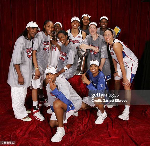 The 2006 WNBA Champion Detroit Shock celebrate with the WNBA Championship trophy after winning Game Five of the WNBA Finals against the Sacramento...