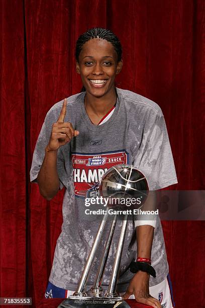 Swin Cash of the 2006 WNBA Champion Detroit Shock celebrates with the WNBA Championship trophy after winning Game Five of the WNBA Finals 80 to 75...