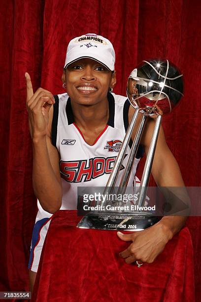Kedra Holland-Corn of the 2006 WNBA Champion Detroit Shock celebrates with the WNBA Championship trophy after winning Game Five of the WNBA Finals 80...