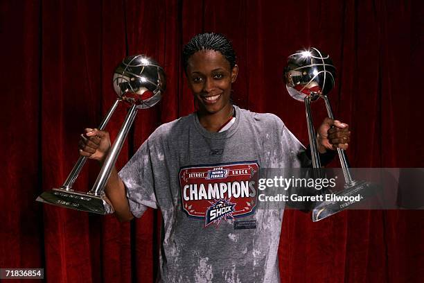 Swin Cash of the 2006 WNBA Champion Detroit Shock poses with the WNBA Championship trophies after winning Game Five of the WNBA Finals 80 to 75...