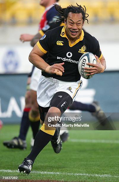 Tana Umaga of the Lions runs in a try during the Air New Zealand Cup match between the Wellington Lions and Tasman at the Westpac Stadium on...