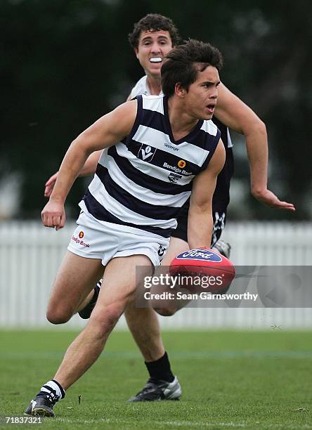 Mathew Stokes for Geelong handballs during the VFL Second Semi Final between the Geelong Cats and the North Ballarat Roosters at TEAC Oval on...