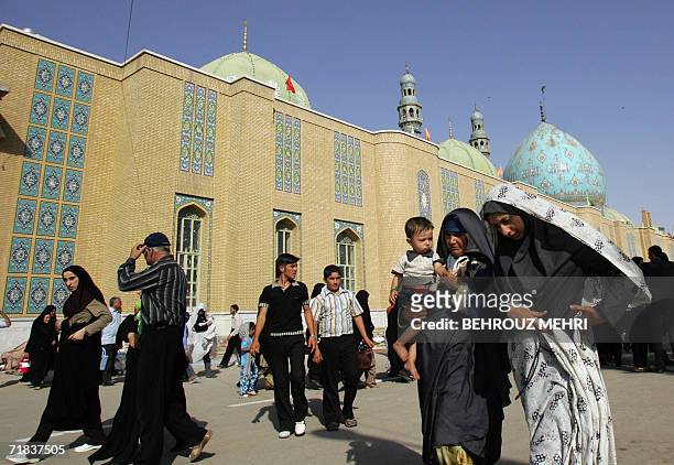 Iranians walk in the courtyard of the Jamkaran mosque outside the religious city of Qom 120 kms south of Tehran, 08 September 2006. Hundreds of...