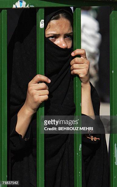 An Iranian woman looks at the Jamkaran mosque outside the religious city of Qom 120 kms south of Tehran, 08 September 2006. Hundreds of thousands of...