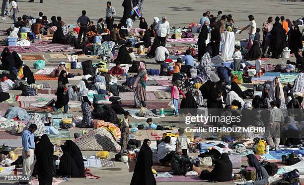 Iranian pilgrims spread carpets on the ground and picnic in the courtyard of the Jamkaran mosque outside the religious city of Qom 120 kms south of...