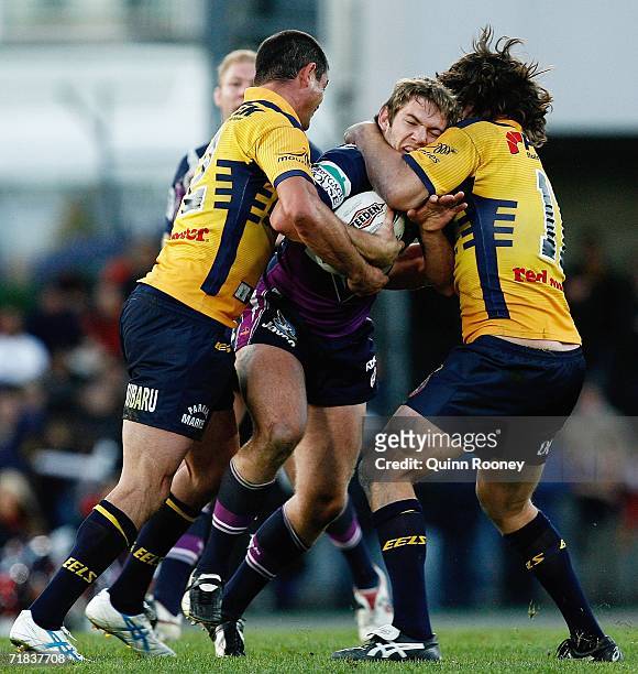 Dallas Johnson of the Storm is tackled by Nathan Hindmarsh of the Eels during the NRL Fourth Qualifying Final between the Melbourne Storm and the...