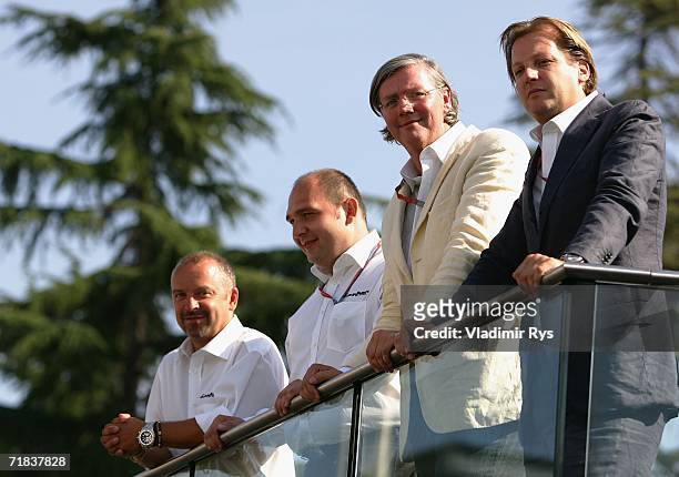 Chief Technology officer Mike Gascoyne, team principal Colin Kolles, chief executive officer Victor R. Muller and director Michiel Mol look on during...