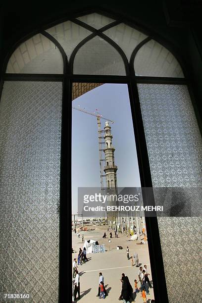 An under construction minaret is seen through a window in the Jamkaran mosque outside the religious city of Qom 120 kms south of Tehran, 08 September...