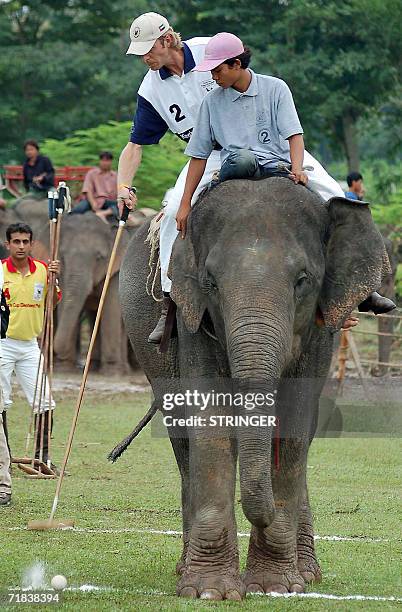 Polo player from the German team hits the ball during a penalty shootout in the final round of the sixth King's Cup Elephant Polo Tournament in the...