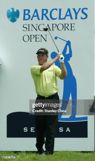 Lee Westwood of England watches his tee shot on the 1st hole during the final round of the Singapore Open at the Sentosa Golf Club on September 10,...