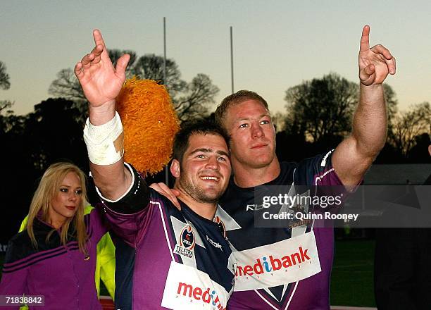 Nathan Friend and Michael Crocker of the Storm waves to the crowd after the NRL Fourth Qualifying Final between the Melbourne Storm and the...