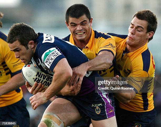 Steve Turner of the Storm is tackled by Daniel Wagon of the Eels during the NRL Fourth Qualifying Final between the Melbourne Storm and the...