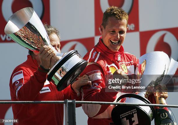 Michael Schumacher of Germany and Ferrari celebrates with Jean Todt after winning the Italian Formula One Grand Prix at the Autodromo Nazionale Monza...