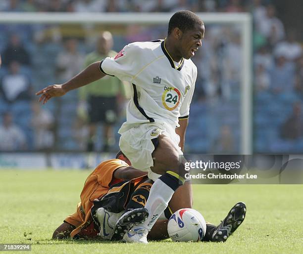 Seb Carole of Leeds is tackled by Mark Little of Wolves during the Coca-Cola Championship match between Leeds United and Wolverhampton Wanderers at...