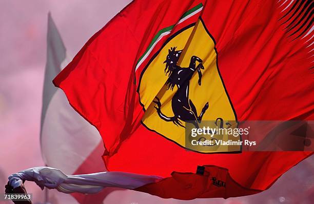 Ferrari fan waves the flag after the end of the Italian Formula One Grand Prix at Autodromo Nazionale Monza on September 10, 2006 in Monza, Italy.