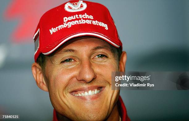 Michael Schumacher of Germany and Ferrari announces his retirement at the end of season during a press conference after winning the Italian Formula...