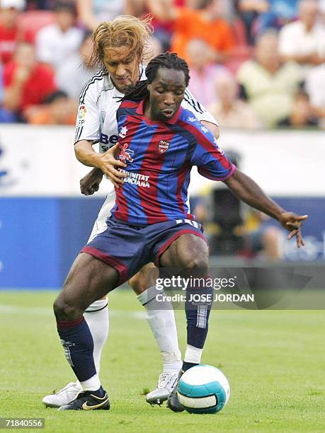 Real Madrid?s Michael Salgado vies for the ball with Levante?s Mustapha Riga from Ghana during their Spanish league football match at Ciudad de...