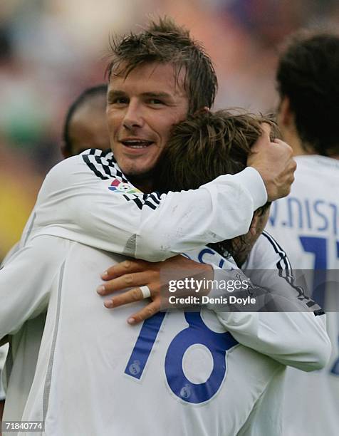 Antonio Cassano celebrates with David Beckham after scoring Real's second goal during the Primera Liga match between Levante and Real Madrid at the...