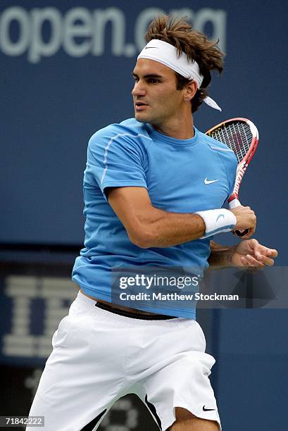 Roger Federer of Switzerland returns a forehand to Andy Roddick during their men's final match in the U.S. Open at the USTA Billie Jean King National...