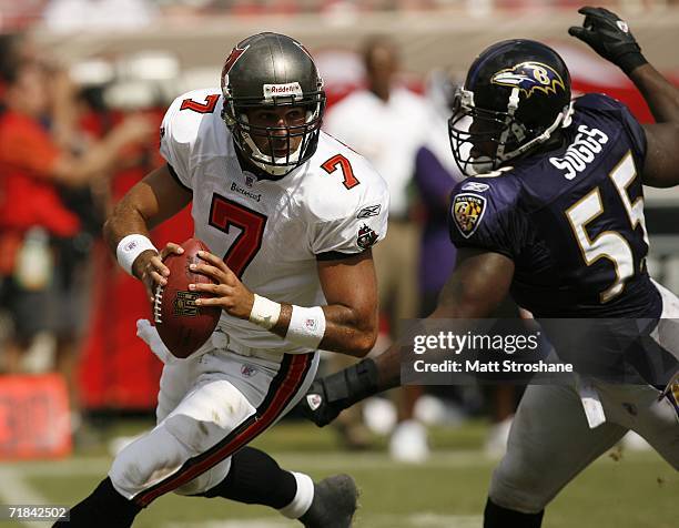 Rookie quarterback Bruce Gradkowski Tampa Bay Buccaneers scrambles away from Terrell Suggs of the Baltimore Ravens on September 10, 2006 at Raymond...