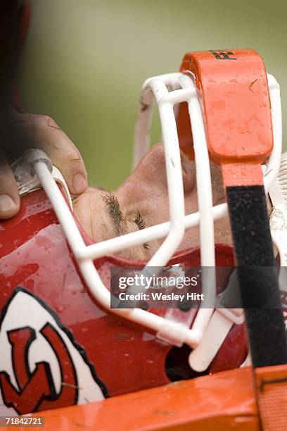 Quarterback Trent Green of the Kansas City Chiefs gets carried off the field in a neck brace during a game against the Cincinnati Bengals on...