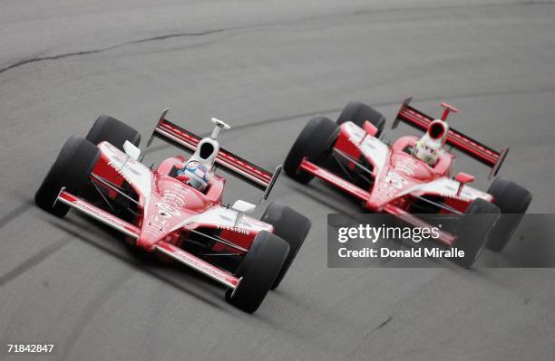 Scott Dixon, driver of the Target Chip Ganassi Dallara Honda, leads teammate Dan Wheldon, driver of the Target Chip Ganassi Dallara Honda, during the...