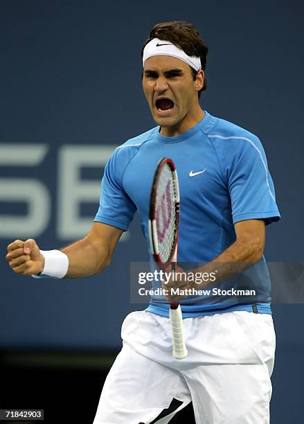 Roger Federer of Switzerland celebrates winning the third set against Andy Roddick during the men's final of the U.S. Open at the USTA Billie Jean...