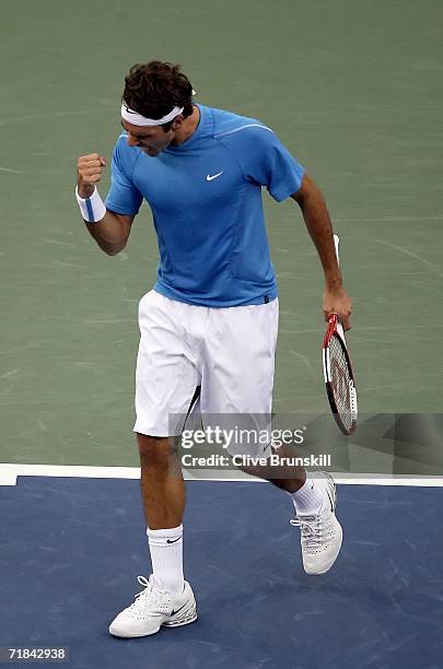 Roger Federer of Switzerland celebrates winning the third set against Andy Roddick during the men's final of the U.S. Open at the USTA Billie Jean...