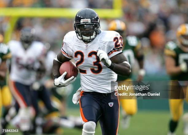 Devin Hester of the Chicago Bears runs back a punt 84 yards for a touchdown against the Green Bay Packers on September 10, 2006 at Lambeau Field in...