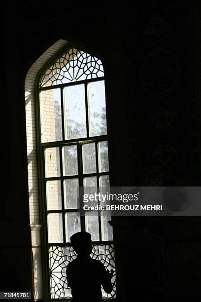 An Iranian man performs his afternoon prayer in the Jamkaran mosque outside the religious city of Qom 120 kms south of Tehran, 08 September 2006....