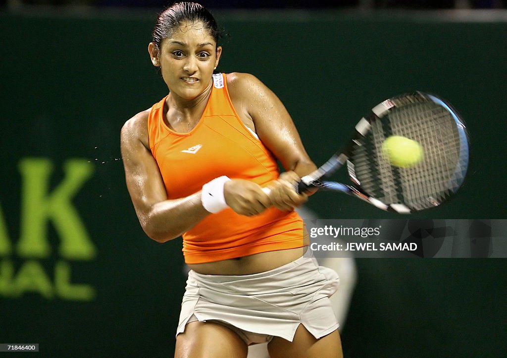 US tennis player Sunitha Rao hits a backhand to her Indonesian... News ...